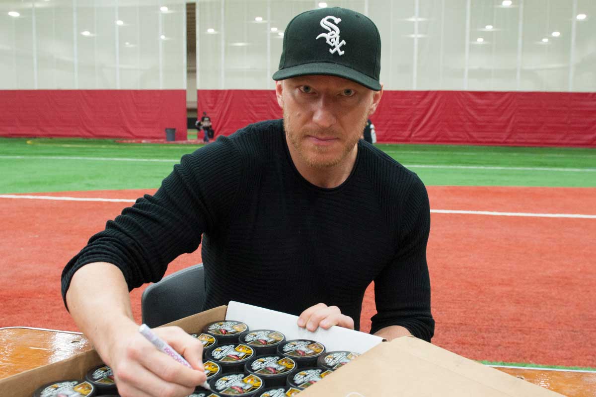Marian Hossa signing autographs at a public signing event in Chicago, Illinois, October 2014