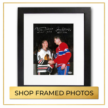 Autographed framed photos collection featuring signed sports memorabilia