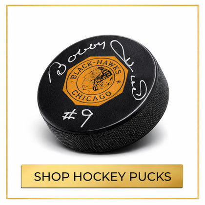 Autographed hockey pucks collection featuring signed NHL hockey pucks