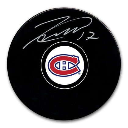 Signed hockey puck featuring Josh Andersons silver autograph and the Montreal Canadiens team logo displayed on the front.