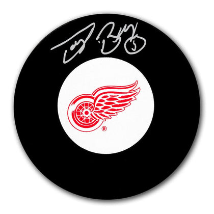Doug Barkley Detroit Red Wings signed hockey puck, featuring a bold autograph on the puck’s flat surface—a prized collectible for NHL fans.