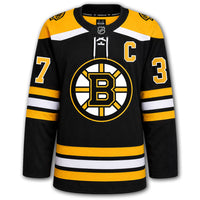 Patrice Bergeron autographed Boston Bruins Fanatics Premium jersey front with black home styling, captain C, Bruins crest and number 37 on the sleeves
