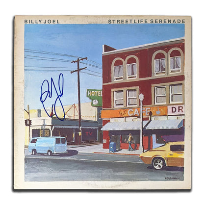 Billy Joel autographed STREETLIFE SERENADE vinyl LP, cover shows a city street scene—premium collectible for devoted fans.