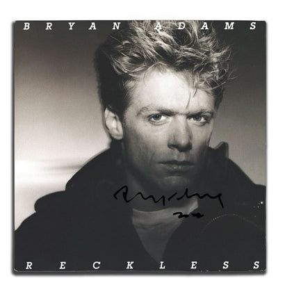 Bryan Adams RECKLESS autographed vinyl LP with clear signature on the black-and-white cover, includes Certificate of Authenticity.