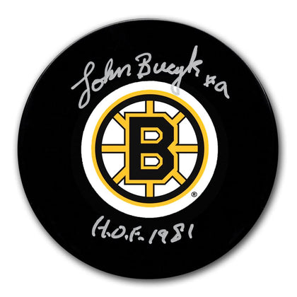 Johnny Bucyk Boston Bruins HOF signed hockey puck, complete with COA—an iconic collectible in official puck format for fans.