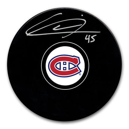 Alexandre Carrier Autographed Montreal Canadiens official game puck, featuring his signature—ideal for fans and memorabilia collectors.