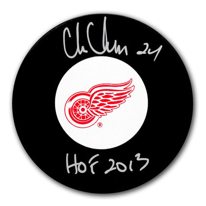 Chris Chelios Detroit Red Wings HOF signed black hockey puck, premium sports memorabilia collectible.