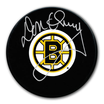 Don Cherry signed Boston Bruins hockey puck with clear autograph, accompanied by Certificate of Authenticity as sports memorabilia.