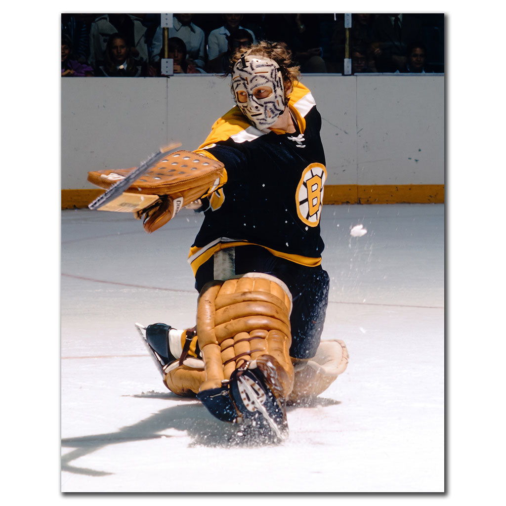 Gerry Cheevers Boston Bruins 8x10 hockey photo wearing his stitched goalie mask and black uniform while making a glove save for autograph pre-order