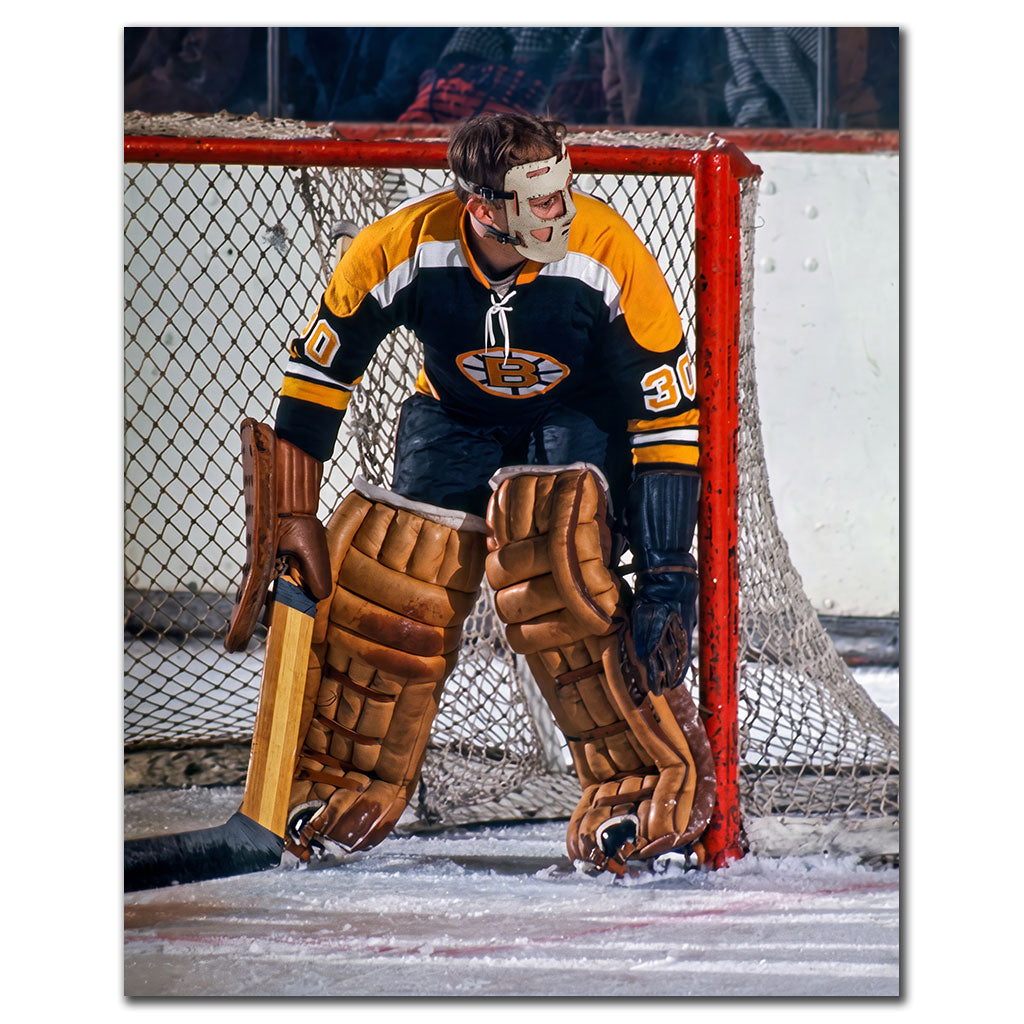 Gerry Cheevers Boston Bruins 8x10 hockey photo without his mask in a black uniform standing in front of the net for autograph pre-order