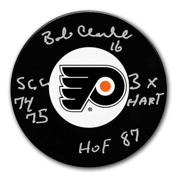 Bobby Clarke autographed Philadelphia Flyers hockey puck with 1974 and 1975 Stanley Cups, 3x Hart and HOF 87 inscriptions