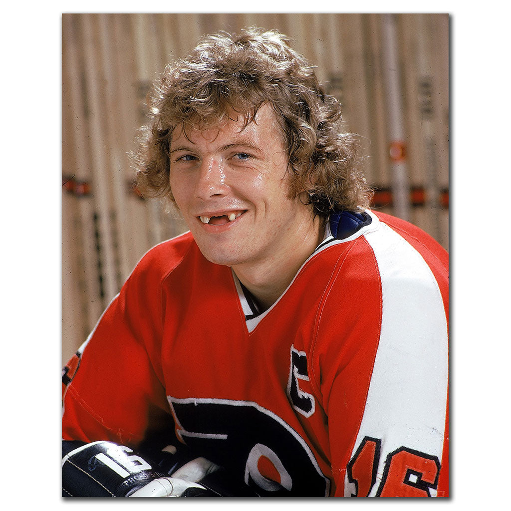 Bobby Clarke signed 8x10 photo in Philadelphia Flyers red uniform, featuring his autograph—perfect addition to Philadelphia Flyers memorabilia.