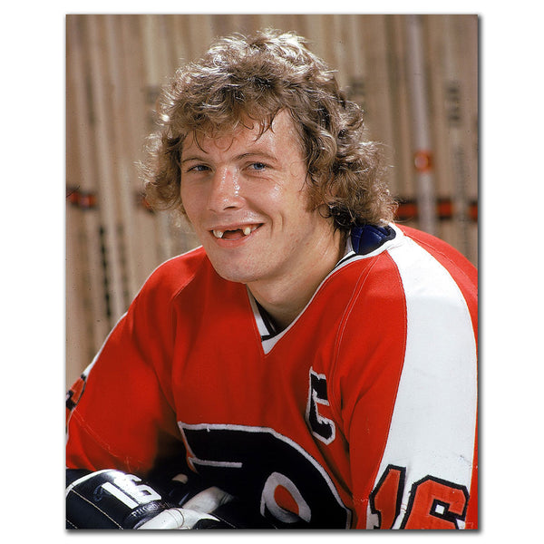 Bobby Clarke signed 8x10 photo in Philadelphia Flyers red uniform, featuring his autograph—perfect addition to Philadelphia Flyers memorabilia.