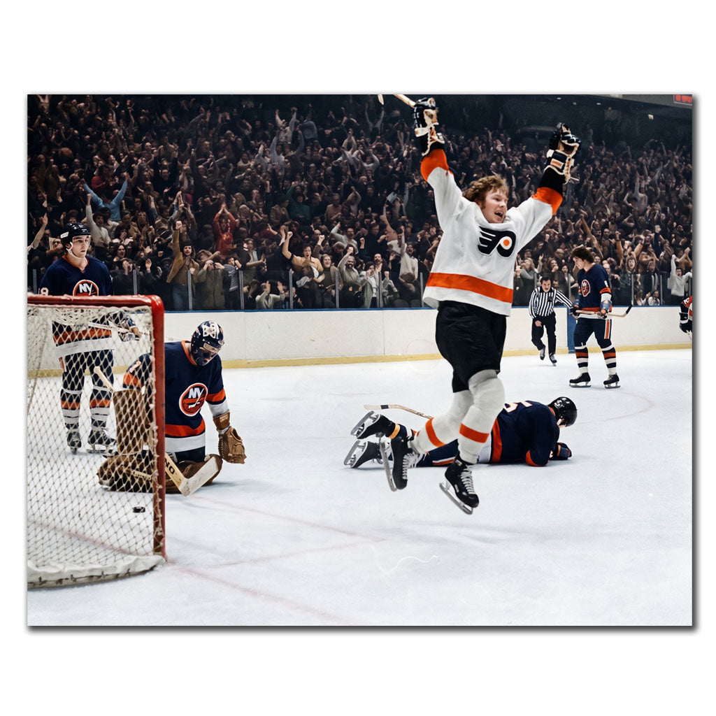 Bobby Clarke signed 8x10 photo in Philadelphia Flyers uniform celebrating a goal—perfect addition to Philadelphia Flyers memorabilia.