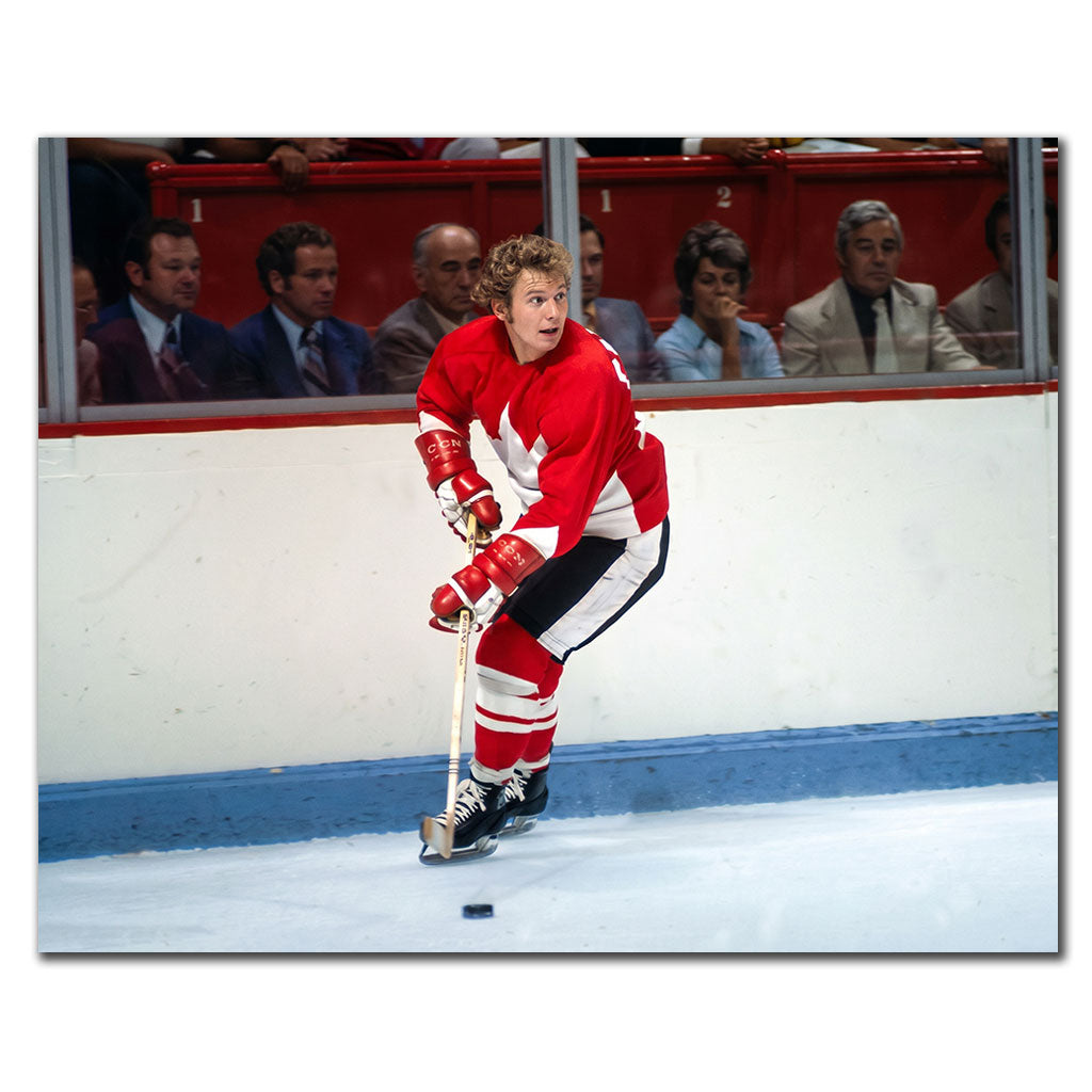Bobby Clarke signed 8x10 photo in Team Canada 1972 Summit Series uniform, skating with the puck—perfect addition to Team Canada memorabilia.