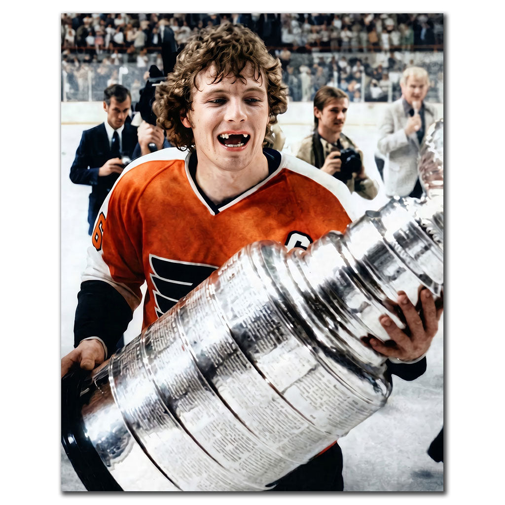 Bobby Clarke signed 16x20 photo in Philadelphia Flyers uniform holding the Stanley Cup, featuring his autograph—perfect addition to Philadelphia Flyers memorabilia.