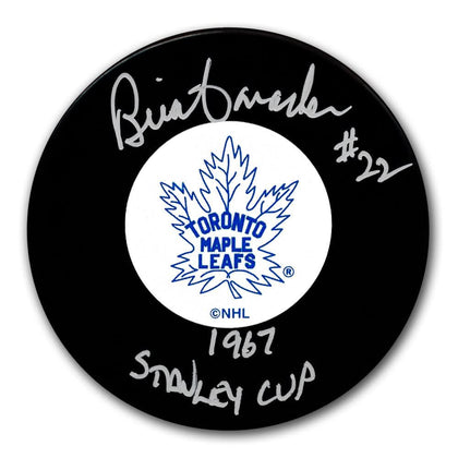 Autographed Toronto Maple Leafs hockey puck signed by Brian Conacher with 1967 Stanley Cup inscription, plus certificate of authenticity.