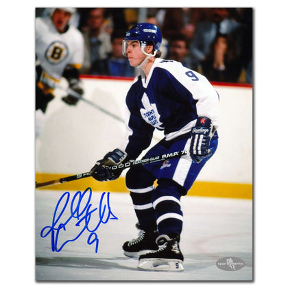 Russ Courtnall Toronto Maple Leafs signed 8x10 photo, featuring his autograph on an action shot of him skating in full team uniform.