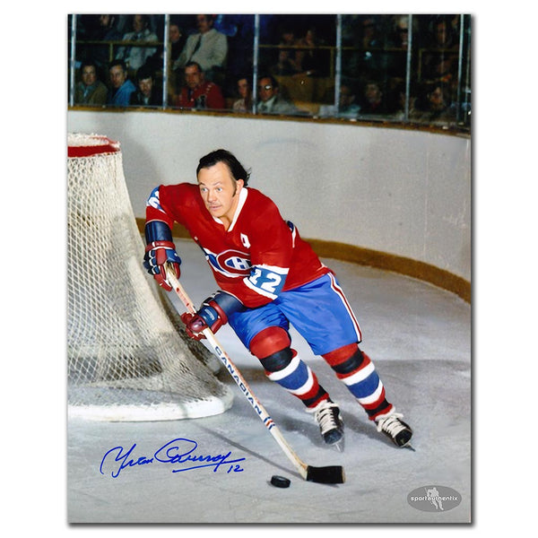 Yvan Cournoyer autographed Montreal Canadiens 8x10 photo in red jersey skating with puck near the net