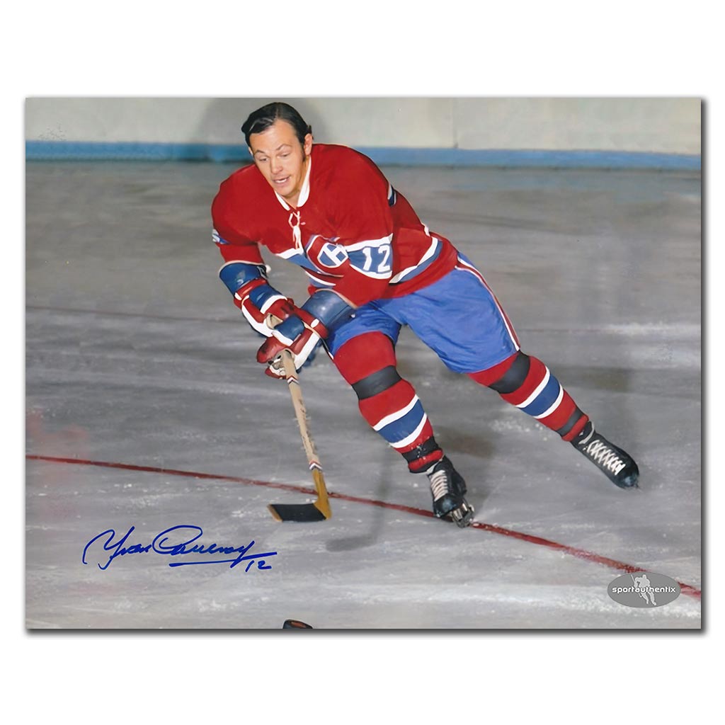 Yvan Cournoyer autographed Montreal Canadiens 8x10 photo in red jersey action pose with puck