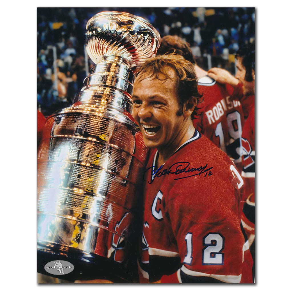 Yvan Cournoyer autographed Montreal Canadiens 8x10 photo celebrating with the Stanley Cup