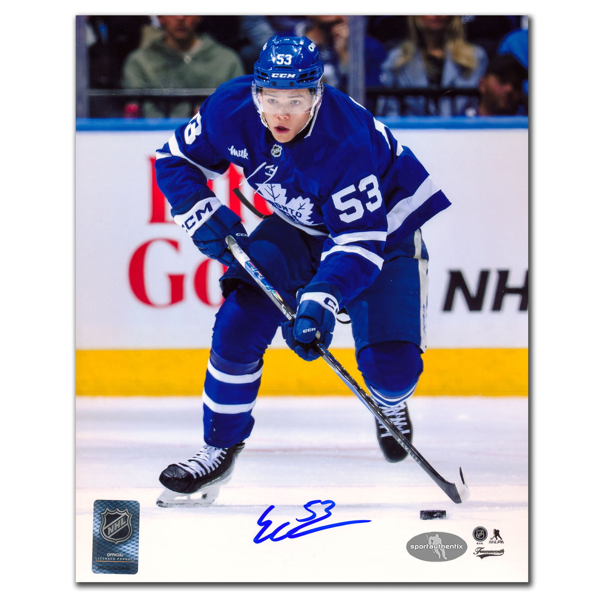 Easton Cowan autographed Toronto Maple Leafs 8x10 photo skating in blue jersey with puck