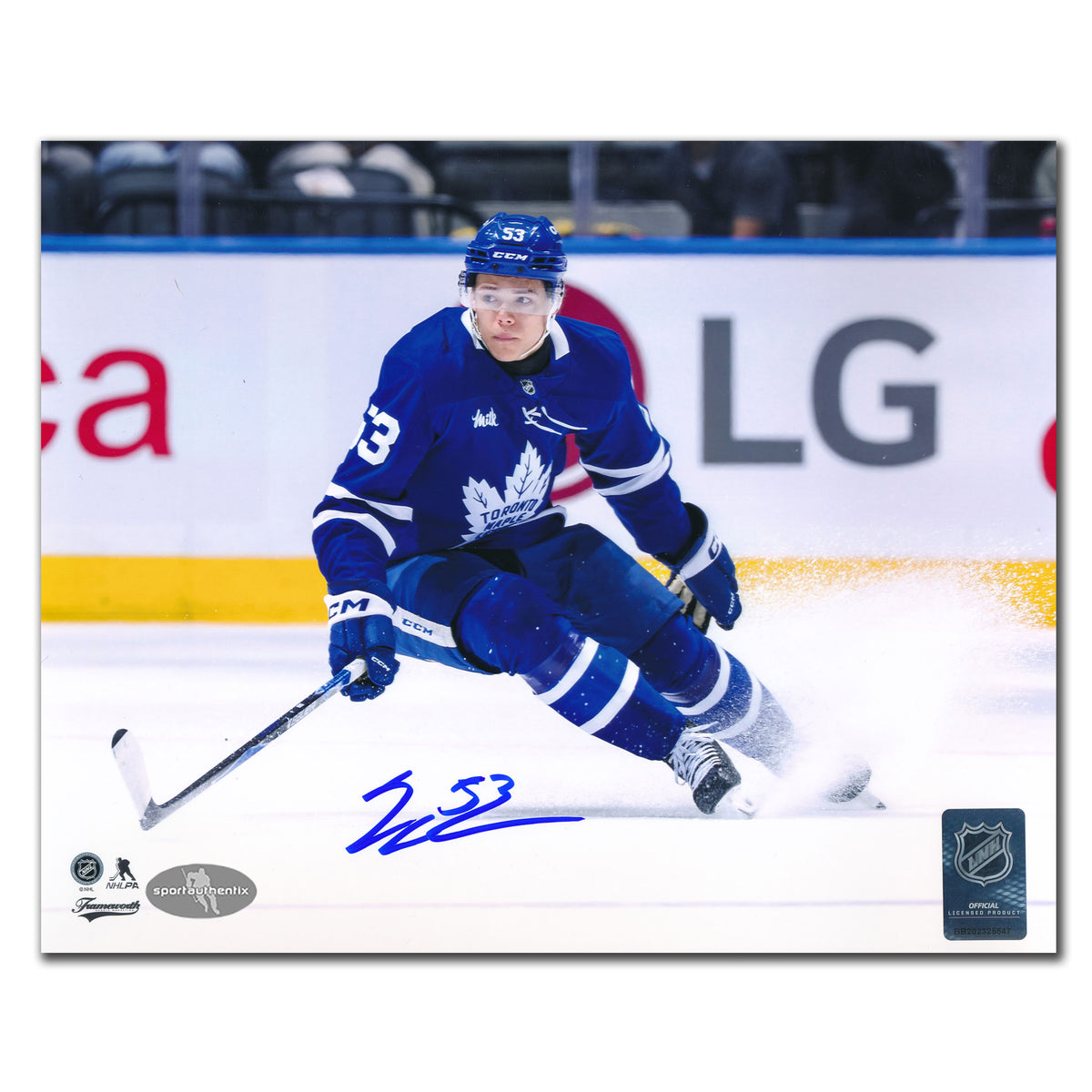 Easton Cowan autographed Toronto Maple Leafs 8x10 photo making sharp turn in blue jersey