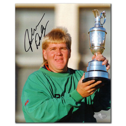 John Daly signed 8x10 photo from the 1995 British Open, featuring him in green holding a trophy with visible autograph on the print.