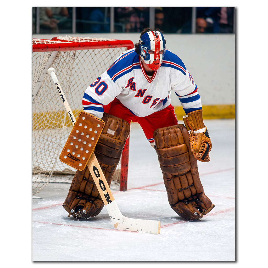 John Davidson New York Rangers 16x20 hockey photo wearing a white Rangers jersey and vintage red, white and blue goalie mask while crouched in a ready stance beside the net for autograph pre-order