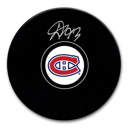 Ivan Demidov signed Montreal Canadiens hockey puck, featuring clear autograph on authentic team puck—perfect for memorabilia collections.
