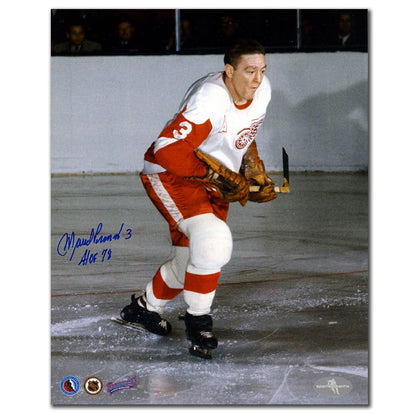 Autographed 8x10 photo of Marcel Pronovost gliding on ice in Detroit Red Wings gear, ideal for memorabilia collections.