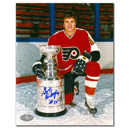 Gary Dornhoefer autographed 8x10 photo celebrating the Flyers’ Stanley Cup, with bold signature and Certificate of Authenticity.