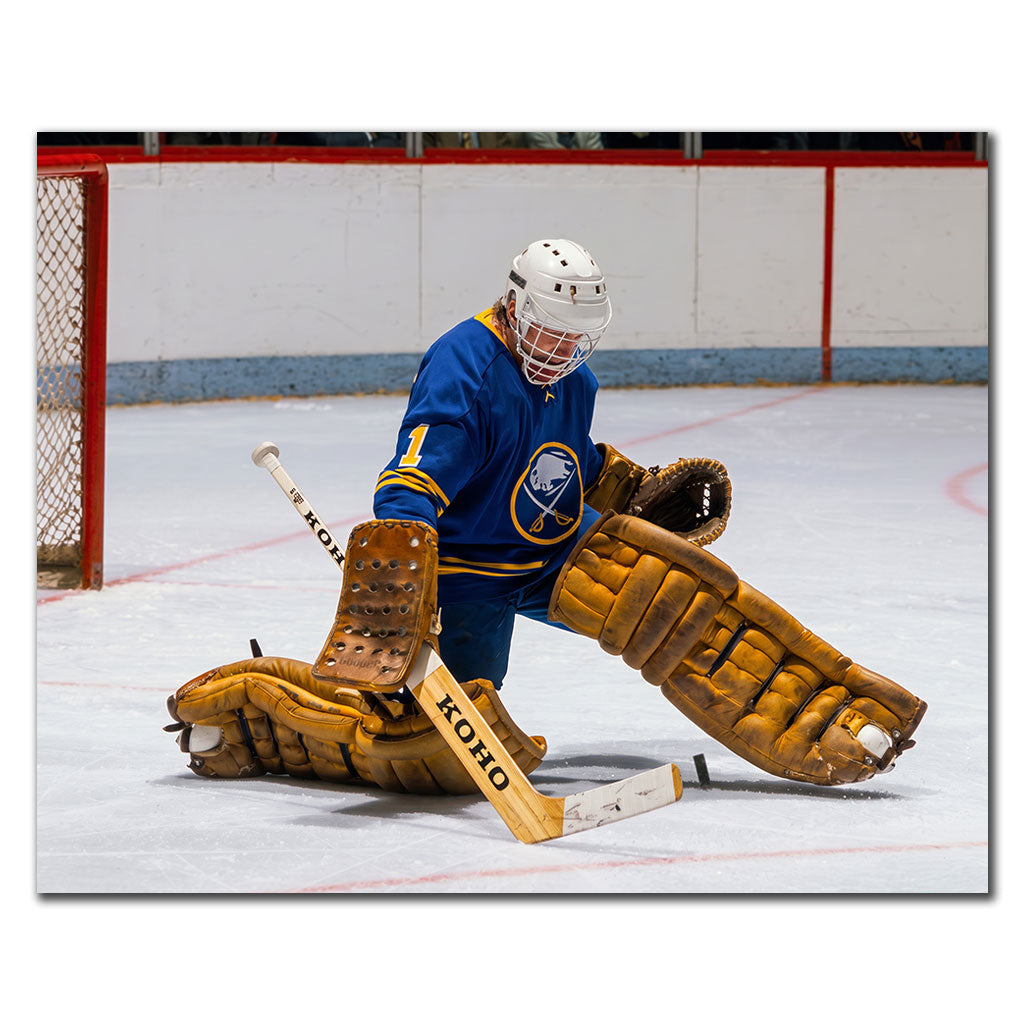 Don Edwards making a save in a blue Buffalo Sabres uniform