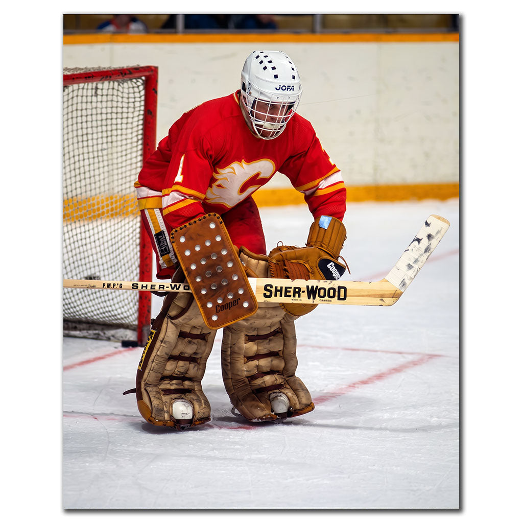 Don Edwards tending goal in a red Calgary Flames uniform