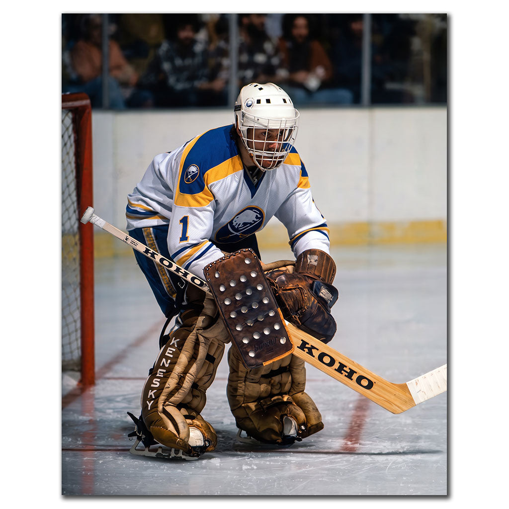 Don Edwards tending goal in a white Buffalo Sabres uniform