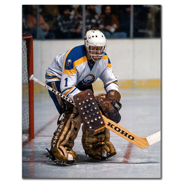 Don Edwards tending goal in a white Buffalo Sabres uniform