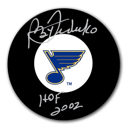 Official St. Louis Blues puck signed by Bernie Federko with HOF inscription—distinctive autographed sports memorabilia.