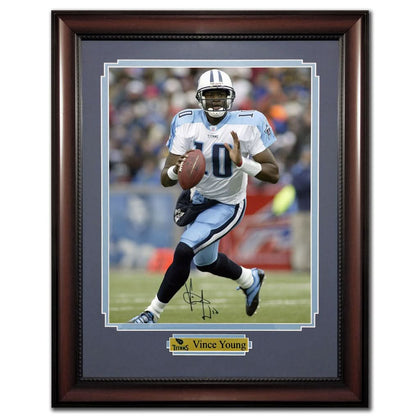 Framed 24x30 photo of Vince Young in his Titans uniform, hand-signed—ideal autographed memorabilia for Tennessee Titans fans.