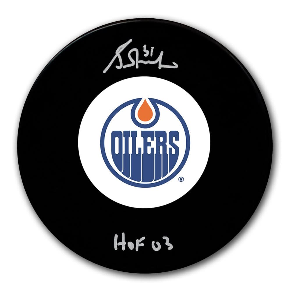 Autographed Edmonton Oilers hockey puck featuring Grant Fuhrs signature, HOF 03 inscription, and the official team logo.