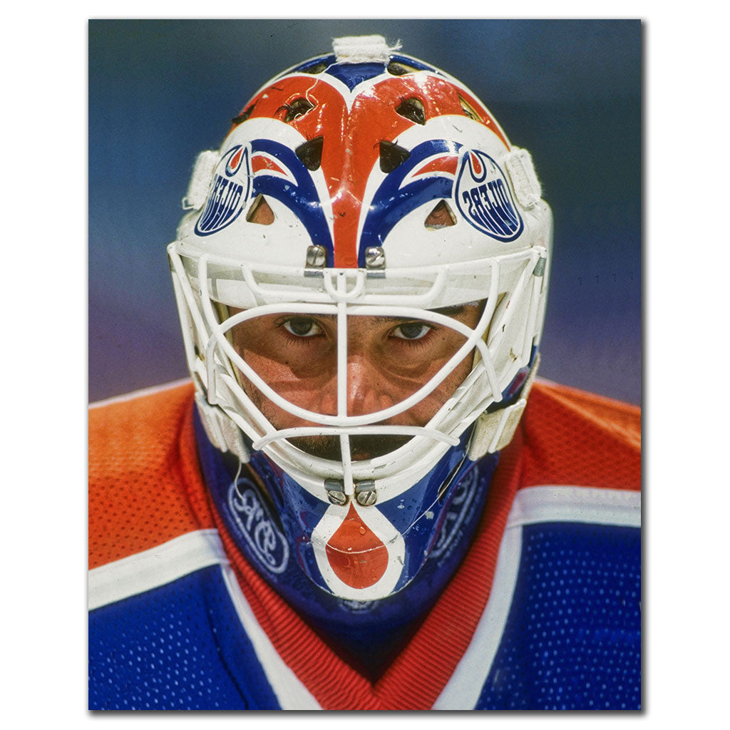 Close-up portrait of Grant Fuhr wearing his Edmonton Oilers goalie mask