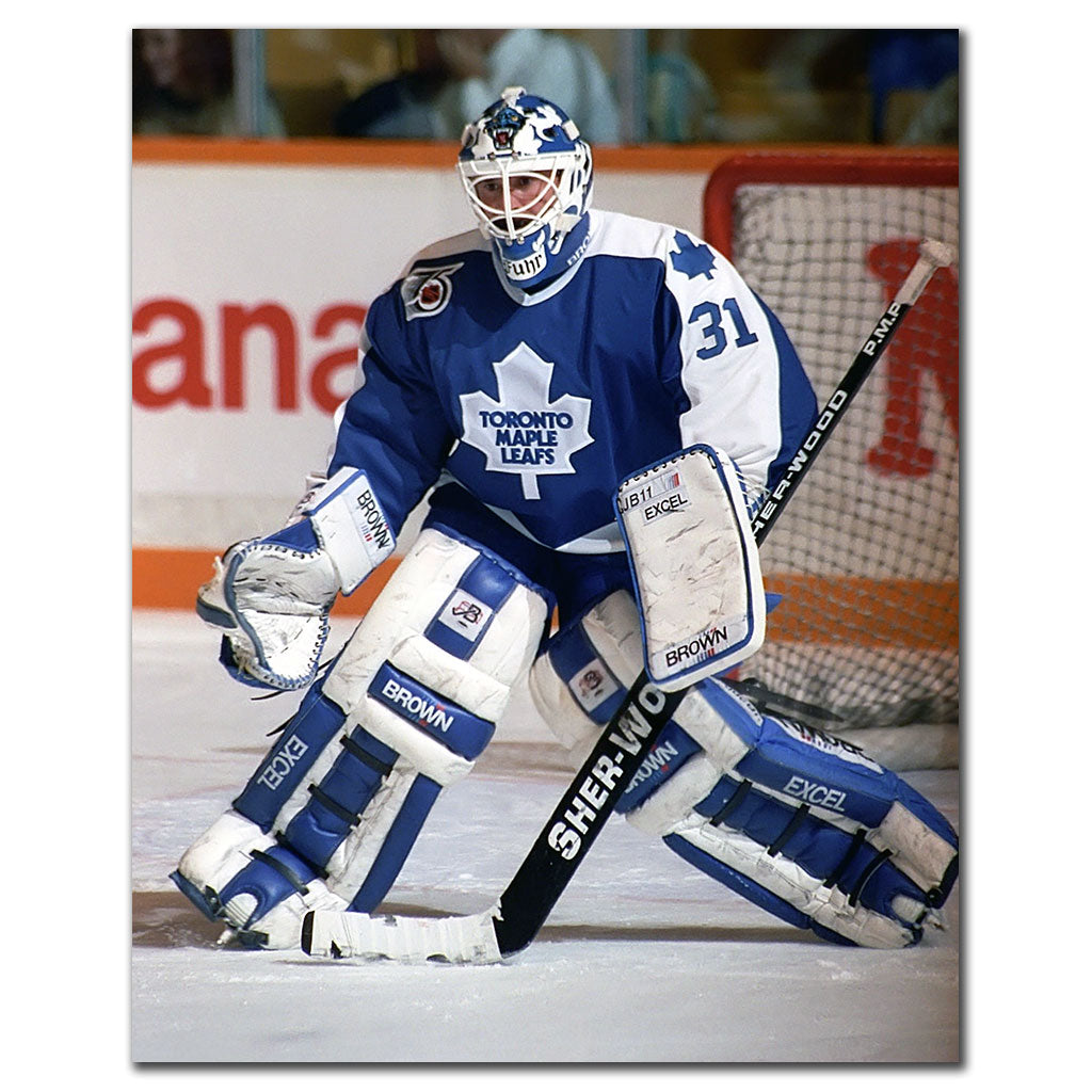 Grant Fuhr tending goal in a white Toronto Maple Leafs uniform