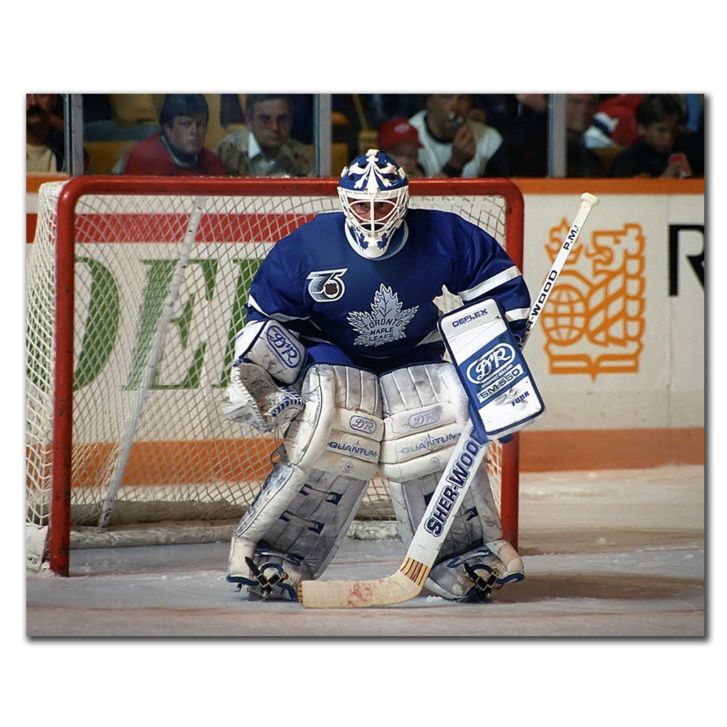 Grant Fuhr positioned in front of the net in a blue Toronto Maple Leafs uniform