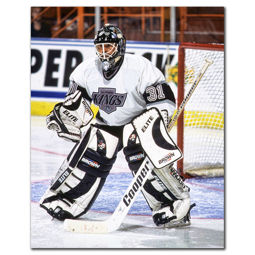 Grant Fuhr tending goal in a white Los Angeles Kings uniform