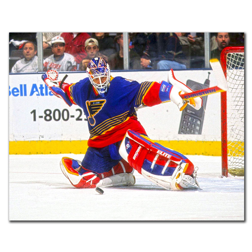 Grant Fuhr making a save in a blue St. Louis Blues uniform