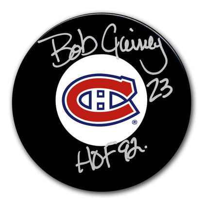 Bob Gainey Montreal Canadiens Hall of Fame collectible puck, hand-signed and inscribed 23 HOF 92 in silver marker.