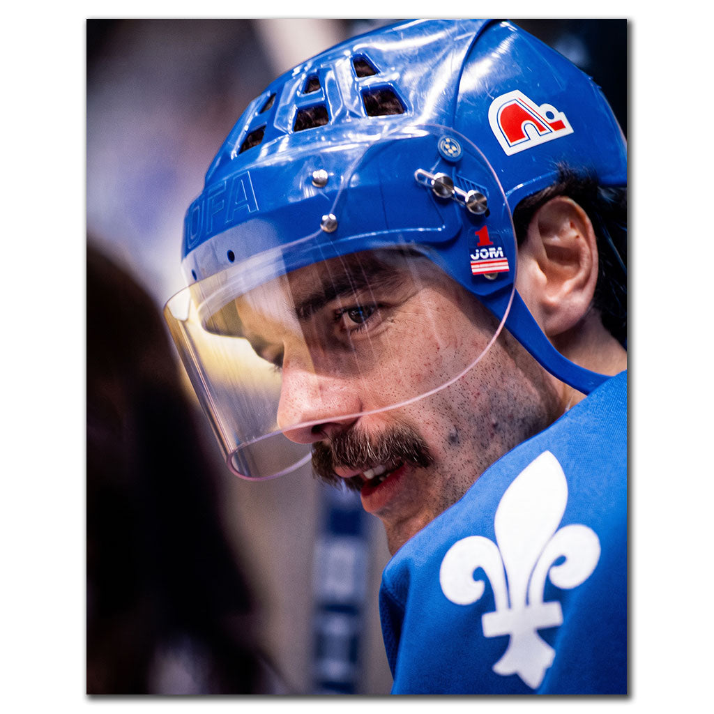 Close-up of Michel Goulet wearing a blue Quebec Nordiques helmet and uniform