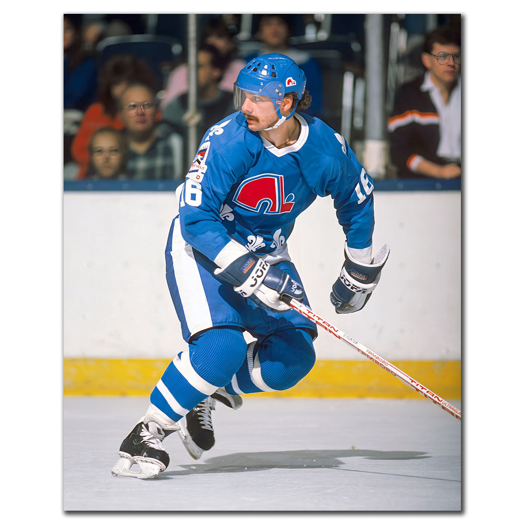 Michel Goulet skating in a blue Quebec Nordiques uniform