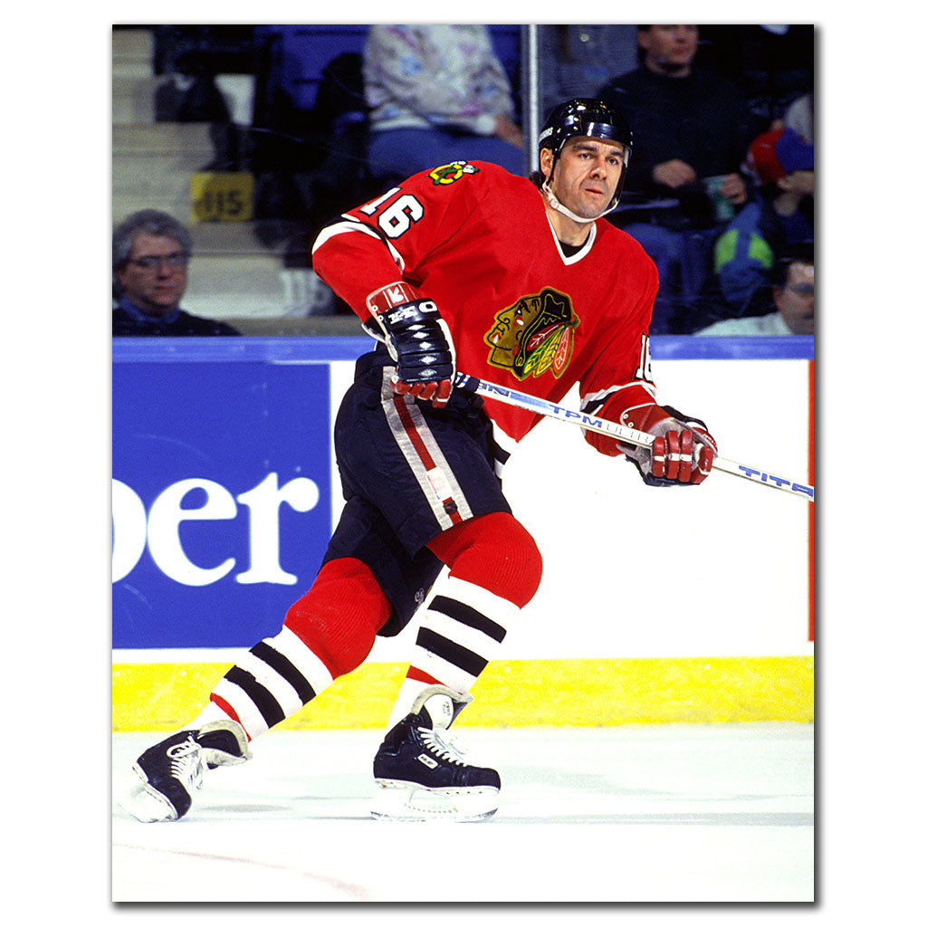 Michel Goulet skating in a red Chicago Blackhawks uniform