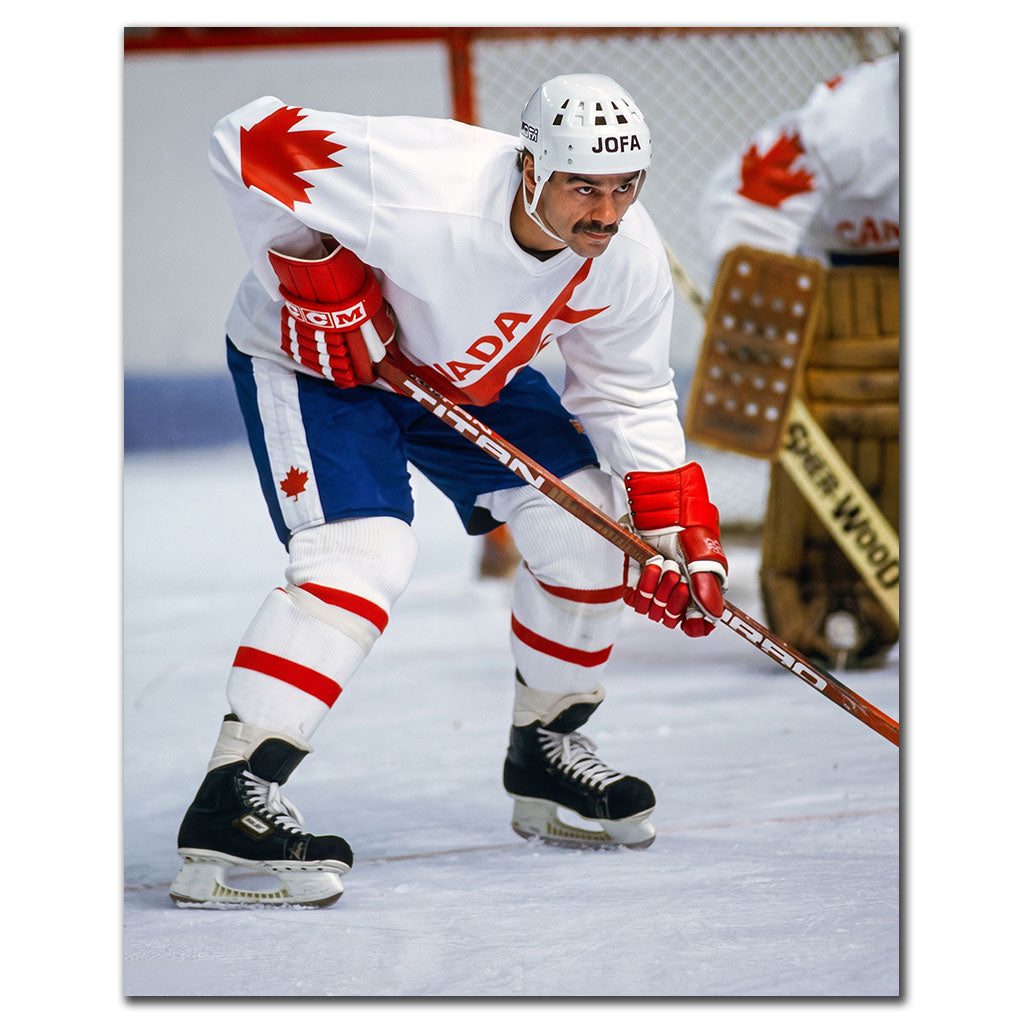 Michel Goulet skating in a white Canada Cup uniform