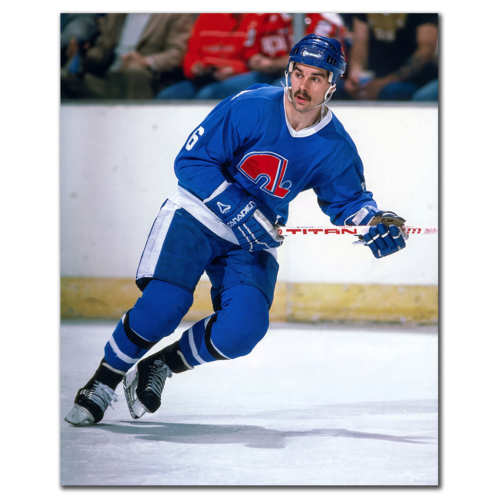 Michel Goulet skating in a blue Quebec Nordiques uniform